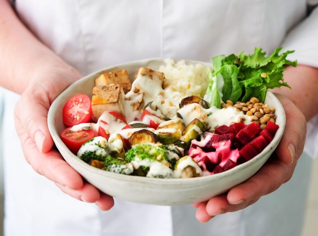 Close-up of a fresh vegetable salad bowl with tofu, perfect for a nutritious meal.