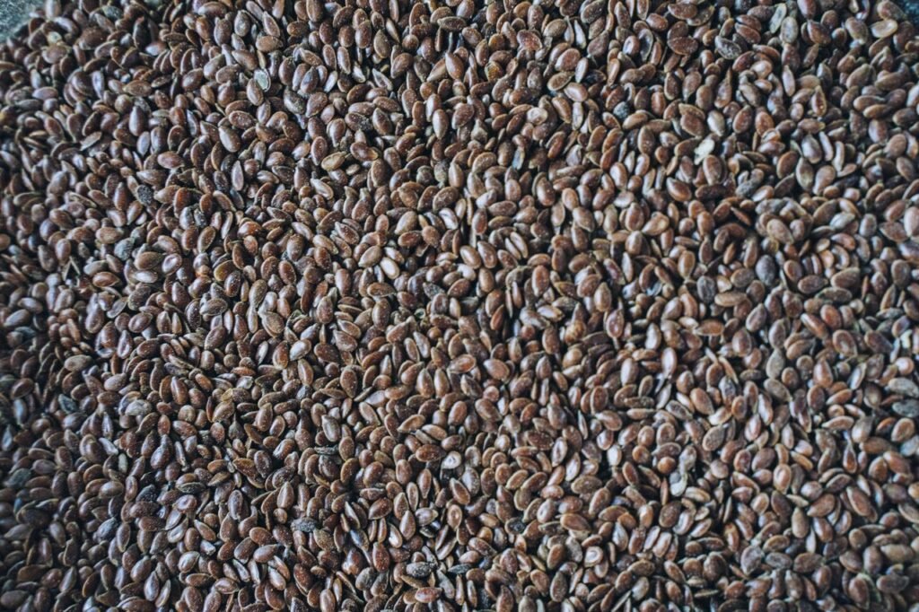 Detailed close-up shot of flax seeds, showcasing their rich brown color and texture.